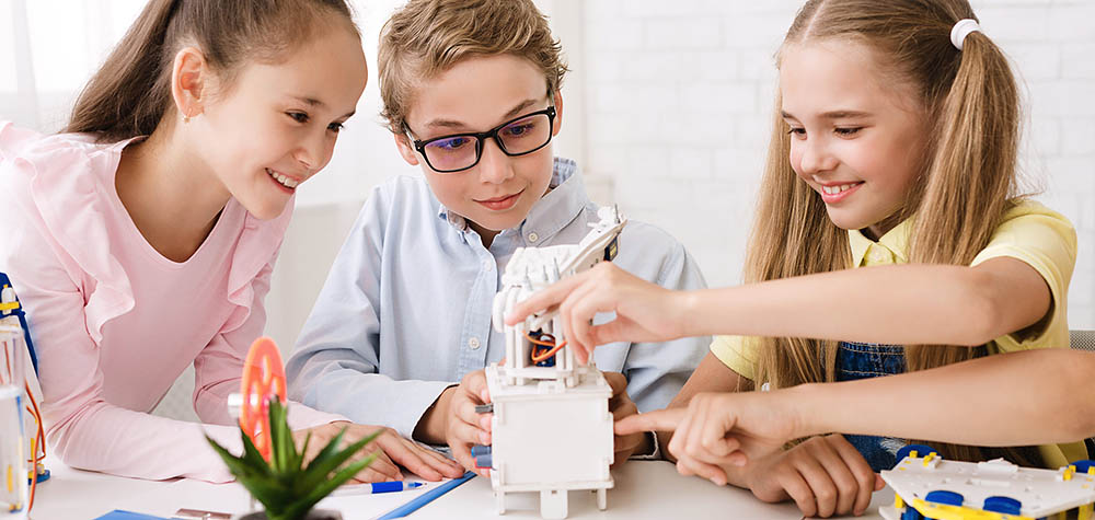 Pupils Creating Robots Together At Stem Class day camps